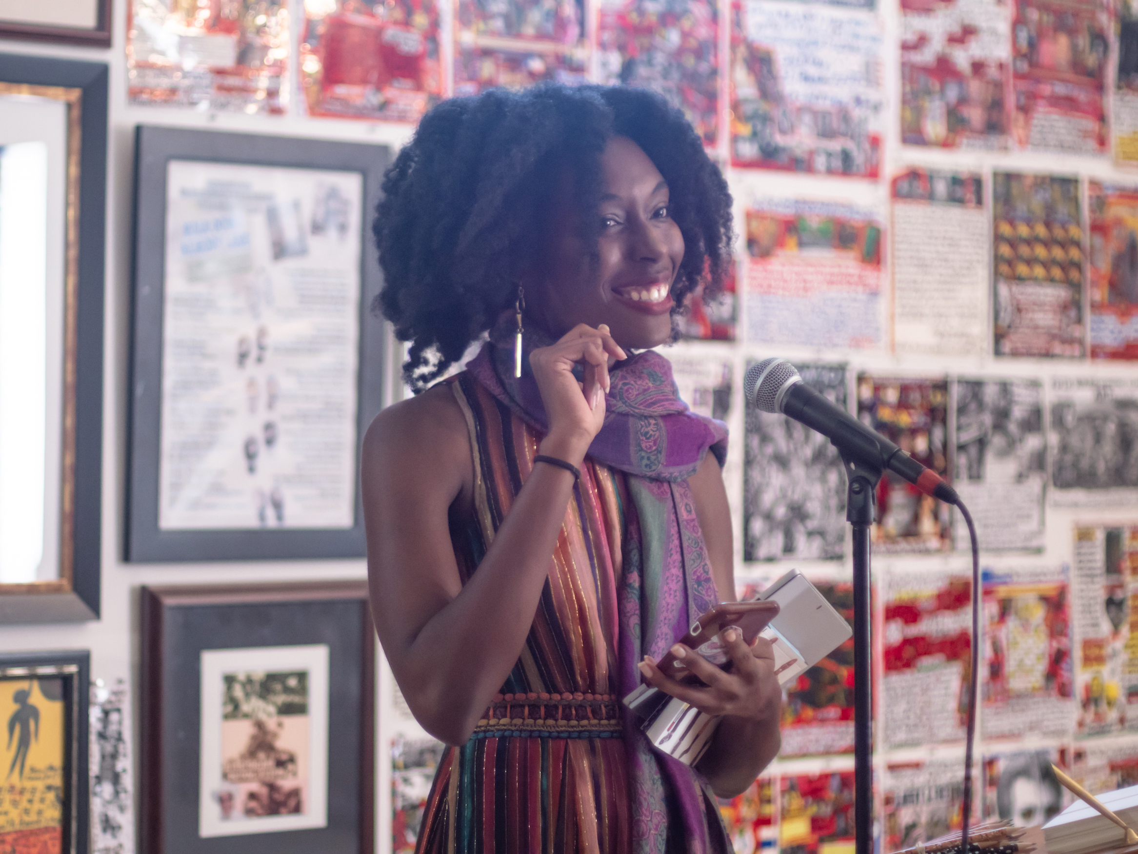 Willow Curry, Grant Writer, standing in front of microphone